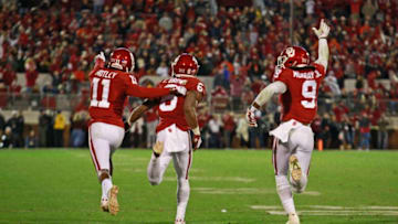 NORMAN, OK - NOVEMBER 10: Cornerback Parnell Motley #11, cornerback Tre Brown #6 and linebacker Kenneth Murray #9 of the Oklahoma Sooners celebrate stopping the Oklahoma State Cowboys on their last series of the game at Gaylord Family Oklahoma Memorial Stadium on November 10, 2018 in Norman, Oklahoma. Oklahoma defeated Oklahoma State 48-47. (Photo by Brett Deering/Getty Images)