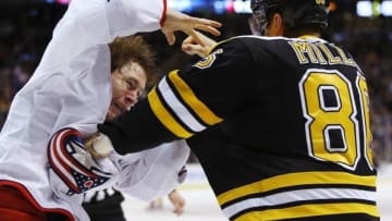 Feb 22, 2016; Boston, MA, USA; Columbus Blue Jackets left wing Matt Calvert (11) fights Boston Bruins defenseman Kevan Miller (86) during the third period of the Columbus Blue Jackets 6-4 win over the Boston Bruins at TD Garden. Mandatory Credit: Winslow Townson-USA TODAY Sports