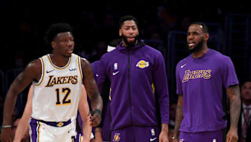 LOS ANGELES, CALIFORNIA - OCTOBER 14: LeBron James #23 and Anthony Davis #3 of the Los Angeles Lakers react behind Devontae Cacok #12 during a 104-98 preseason win over the Golden State Warriors at Staples Center on October 14, 2019 in Los Angeles, California. (Photo by Harry How/Getty Images)
