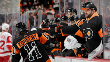 PHILADELPHIA, PENNSYLVANIA - FEBRUARY 16: Travis Konecny #11 of the Philadelphia Flyers celebrates his goal with teammates on the bench in the second period against the Detroit Red Wings at Wells Fargo Center on February 16, 2019 in Philadelphia, Pennsylvania. (Photo by Elsa/Getty Images)