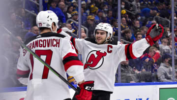 Feb 10, 2022; St. Louis, Missouri, USA; New Jersey Devils center Nico Hischier (13) congratulates center Yegor Sharangovich (17) after a he scored a goal against the St. Louis Blues during the third period at Enterprise Center. Mandatory Credit: Jeff Curry-USA TODAY Sports