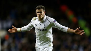 LONDON, ENGLAND - FEBRUARY 14: Gareth Bale of Spurs celebrates after scoring his team's match winning second goal from a free kick during the UEFA Europa League round of 32 first leg match between Tottenham Hotspur and Olympique Lyonnais at White Hart Lane on February 14, 2013 in London, England. (Photo by Paul Gilham/Getty Images)