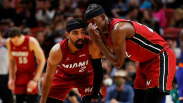Jimmy Butler #22 talks to Gabe Vincent #2 of the Miami Heat(Photo by Cliff Hawkins/Getty Images)