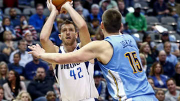 Feb 26, 2016; Dallas, TX, USA; Dallas Mavericks forward David Lee (42) shoots over Denver Nuggets center Nikola Jokic (15) during the first quarter at American Airlines Center. Mandatory Credit: Kevin Jairaj-USA TODAY Sports