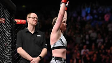 Mar 19, 2022; London, UK; Molly McCann (red gloves) defeats Luana Carolina (blue gloves) during UFC Fight Night at O2 Arena. Mandatory Credit: Per Haljestam-USA TODAY Sports