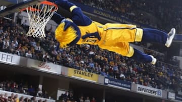 Dec 28, 2015; Indianapolis, IN, USA; Indiana Pacers mascot Boomer dunks the ball performing during a time out in a game against the Atlanta Hawks at Bankers Life Fieldhouse. Indiana defeats Atlanta 93-87. Mandatory Credit: Brian Spurlock-USA TODAY Sports