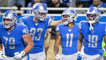 DETROIT, MI - OCTOBER 20: Marvin Jones #11 of the Detroit Lions scores a first quarter touchdown and celebrants with teammate Jesse James #83 during the game against the Minnesota Vikings at Ford Field on October 20, 2019 in Detroit, Michigan. (Photo by Leon Halip/Getty Images)