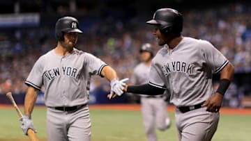 ST PETERSBURG, FL - JULY 24: Miguel Andujar #41 of the New York Yankees is congratulated after scoring by Brett Gardner #11 in the seventh inning during a game against the Tampa Bay Rays at Tropicana Field on July 24, 2018 in St Petersburg, Florida. (Photo by Mike Ehrmann/Getty Images)