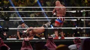 Kurt Angle (R) performs the ankle lock on Dolph Ziggler during the WWE World Cup Quarterfinal match as part of as part of the World Wrestling Entertainment (WWE) Crown Jewel pay-per-view at the King Saud University Stadium in Riyadh on November 2, 2018. (Photo by Fayez Nureldine / AFP) (Photo credit should read FAYEZ NURELDINE/AFP/Getty Images)