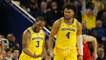 ANN ARBOR, MICHIGAN - JANUARY 29: Zavier Simpson #3 of the Michigan Wolverines reacts after a three point basket next to Isaiah Livers #4 while playing the Ohio State Buckeyes at Crisler Arena on January 29, 2019 in Ann Arbor, Michigan. Michigan won the game 65-49. (Photo by Gregory Shamus/Getty Images)
