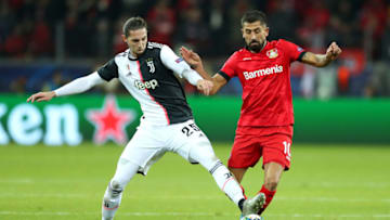 LEVERKUSEN, GERMANY - DECEMBER 11: Kerem Demirbay of Bayer 04 Leverkusen (R) is challenged by Adrien Rabiot of Juventus during the UEFA Champions League group D match between Bayer Leverkusen and Juventus at BayArena on December 11, 2019 in Leverkusen, Germany. (Photo by Lars Baron/Getty Images)