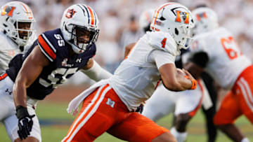 Auburn footballSep 3, 2022; Auburn, Alabama, USA; Auburn Tigers linebacker Eku Leota (55) closes in on Mercer Bears quarterback Fred Payton (4) during the second quarter at Jordan-Hare Stadium. Mandatory Credit: John Reed-USA TODAY Sports