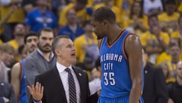 May 30, 2016; Oakland, CA, USA; Oklahoma City Thunder head coach Billy Donovan (left) talks to forward Kevin Durant (35) during the fourth quarter in game seven of the Western conference finals of the NBA Playoffs against the Golden State Warriors at Oracle Arena. The Warriors defeated the Thunder 96-88. Mandatory Credit: Kyle Terada-USA TODAY Sports