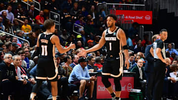 ATLANTA, GA - NOVEMBER 20: Trae Young #11 and Evan Turner #1 of the Atlanta Hawks hi-five during a game against the Milwaukee Bucks on November 20, 2019 at State Farm Arena in Atlanta, Georgia. NOTE TO USER: User expressly acknowledges and agrees that, by downloading and/or using this Photograph, user is consenting to the terms and conditions of the Getty Images License Agreement. Mandatory Copyright Notice: Copyright 2019 NBAE (Photo by Scott Cunningham/NBAE via Getty Images)
