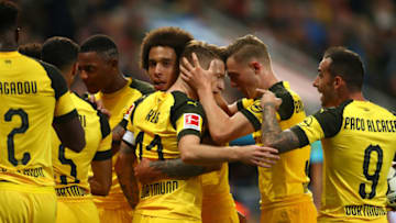 LEVERKUSEN, GERMANY - SEPTEMBER 29: Marco Reus (C) of Borussia Dortmund celebrates with teammates after scoring his team's second goal during the Bundesliga match between Bayer 04 Leverkusen and Borussia Dortmund at BayArena on September 29, 2018 in Leverkusen, Germany. (Photo by Lars Baron/Bongarts/Getty Images)