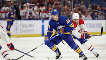 Oct 27, 2022; Buffalo, New York, USA; Buffalo Sabres center Dylan Cozens (24) skates with the puck as Montreal Canadiens center Nick Suzuki (14) defends during the second period at KeyBank Center. Mandatory Credit: Timothy T. Ludwig-USA TODAY Sports