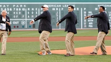 Aug 14, 2014; Boston, MA, USA; Boston Red Sox Hall of Fame Class of 2014, Joseph John Castiglione (left), Roger Clemens, Nomar Garciaparra and Pedro Martinez throw out the first pitch before the game against the Houston Astros at Fenway Park. Mandatory Credit: Greg M. Cooper-USA TODAY Sports
