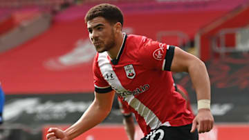 Southampton's English midfielder Che Adams celebrates after scoring their first goal during the English Premier League football match between Southampton and Brighton and Hove Albion at St Mary's Stadium in Southampton, southern England on March 14, 2021. - RESTRICTED TO EDITORIAL USE. No use with unauthorized audio, video, data, fixture lists, club/league logos or 'live' services. Online in-match use limited to 120 images. An additional 40 images may be used in extra time. No video emulation. Social media in-match use limited to 120 images. An additional 40 images may be used in extra time. No use in betting publications, games or single club/league/player publications. (Photo by Glyn KIRK / POOL / AFP) / RESTRICTED TO EDITORIAL USE. No use with unauthorized audio, video, data, fixture lists, club/league logos or 'live' services. Online in-match use limited to 120 images. An additional 40 images may be used in extra time. No video emulation. Social media in-match use limited to 120 images. An additional 40 images may be used in extra time. No use in betting publications, games or single club/league/player publications. / RESTRICTED TO EDITORIAL USE. No use with unauthorized audio, video, data, fixture lists, club/league logos or 'live' services. Online in-match use limited to 120 images. An additional 40 images may be used in extra time. No video emulation. Social media in-match use limited to 120 images. An additional 40 images may be used in extra time. No use in betting publications, games or single club/league/player publications. (Photo by GLYN KIRK/POOL/AFP via Getty Images)