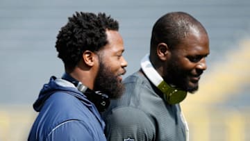 GREEN BAY, WI - SEPTEMBER 10: Michael Bennett #72 of the Seattle Seahawks (L) talks with brother Martellus Bennett #80 of the Green Bay Packers before their game at Lambeau Field on September 10, 2017 in Green Bay, Wisconsin. (Photo by Joe Robbins/Getty Images)