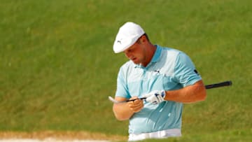 ATLANTA, GEORGIA - SEPTEMBER 04: Bryson DeChambeau of the United States reacts to his shot from a bunker on the 18th hole during the first round of the TOUR Championship at East Lake Golf Club on September 04, 2020 in Atlanta, Georgia. (Photo by Kevin C. Cox/Getty Images)