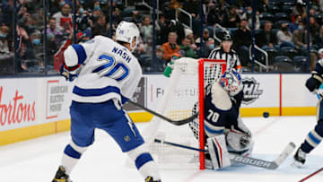 Jan 4, 2022; Columbus, Ohio, USA; Columbus Blue Jackets goalie Joonas Korpisalo (70) makes a save the shot from Tampa Bay Lightning center Riley Nash (20) during the third period at Nationwide Arena. Mandatory Credit: Russell LaBounty-USA TODAY Sports