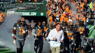 Dec 30, 2016; Nashville , TN, USA; Tennessee Volunteers head coach Butch Jones leads his team onto the field before the Music City Bowl against the Nebraska Cornhuskers at Nissan Stadium. Mandatory Credit: Christopher Hanewinckel-USA TODAY Sports