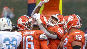 Clemson tight end Braden Galloway(88) celebrates the touchdown by quarterback Trevor Lawrence(16) near The Citadel linebacker Anthony Britton Jr.(39) during the first quarter of the game Saturday, Sept. 19, 2020 at Memorial Stadium in Clemson, S.C.Clemson The Citadel Ncaa Football