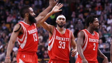 Jan 30, 2015; Boston, MA, USA; Houston Rockets guard James Harden (13), guard Corey Brewer (33) and guard Patrick Beverley (2) celebrate against the Boston Celtics during the second half at TD Garden. Mandatory Credit: Mark L. Baer-USA TODAY Sports