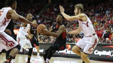 Jan 6, 2016; College Park, MD, USA; Maryland Terrapins forward Jake Layman (10) defends as Rutgers Scarlet Knights guard Omari Grier (31) drives to the basket at Xfinity Center. Mandatory Credit: Mitch Stringer-USA TODAY Sports