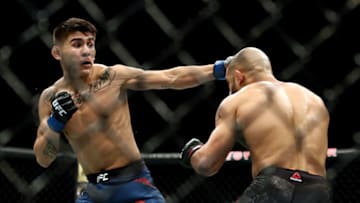 HOUSTON, TEXAS - FEBRUARY 08: (L-R) Mario Bautista and Miles Johns in their Bantamweight boutduring UFC 247 at Toyota Center on February 08, 2020 in Houston, Texas. (Photo by Ronald Martinez/Getty Images)