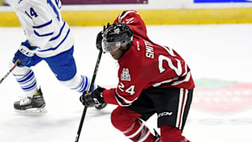 TORONTO, ON - OCTOBER 12: Givani Smith #24 of the Guelph Storm controls the puck against the Mississauga Steelheads during game action at Hershey Centre on October 12, 2016 in Mississauga, Ontario, Canada.( Photo by Graig Abel/Getty Images)