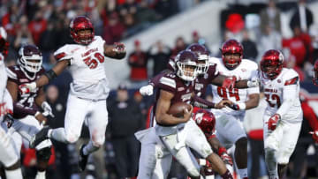 JACKSONVILLE, FL - DECEMBER 30: Keytaon Thompson #10 of the Mississippi State Bulldogs runs the ball in the fourth quarter of the TaxSlayer Bowl against the Louisville Cardinals at EverBank Field on December 30, 2017 in Jacksonville, Florida. The Bulldogs won 31-27. (Photo by Joe Robbins/Getty Images)