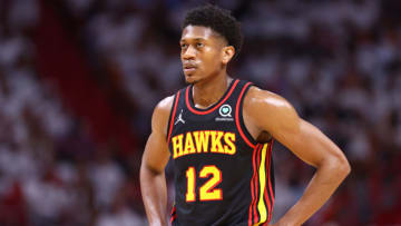 MIAMI, FLORIDA - APRIL 17: De'Andre Hunter #12 of the Atlanta Hawks looks on against the Miami Heat during the first quarter in Game One of the Eastern Conference First Round at FTX Arena on April 17, 2022 in Miami, Florida. NOTE TO USER: User expressly acknowledges and agrees that, by downloading and or using this photograph, User is consenting to the terms and conditions of the Getty Images License Agreement. (Photo by Michael Reaves/Getty Images)