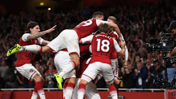 LONDON, ENGLAND - AUGUST 11: Olivier Giroud (obscured) of Arsenal celebrates with teammates after scoring his team's fourth goal during the Premier League match between Arsenal and Leicester City at the Emirates Stadium on August 11, 2017 in London, England. (Photo by Shaun Botterill/Getty Images)