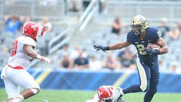 Sep 5, 2015; Pittsburgh, PA, USA; Pittsburgh Panthers running back James Conner (24) rushes the ball as Youngstown State Penguins linebacker Jaylin Kelly (40) and cornerback David Rivers (31) defend during the first half at Heinz Field. The Panthers won 45-37. Mandatory Credit: Charles LeClaire-USA TODAY Sports