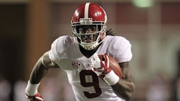 Oct 8, 2016; Fayetteville, AR, USA; Alabama Crimson Tide running back Bo Scarbrough (9) rushes for a touchdown against the Arkansas Razorbacks during the second quarter at Donald W. Reynolds Razorback Stadium. Mandatory Credit: Nelson Chenault-USA TODAY Sports