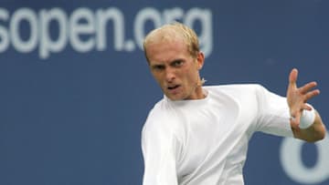 FLUSHING MEADOWS, UNITED STATES: Number seven seeded Nikolay Davydenko of Russia returns the ball to number 14 seeded Tommy Haas of Germany 07 September 2006 during the 2006 US Open Tennis Championships quarter-finals match in Flushing Meadows, New York. Davydenko won 4-6, 6-7 (3/7), 6-3, 6-4, 6-4. AFP PHOTO/DON EMMERT (Photo credit should read DON EMMERT/AFP via Getty Images)