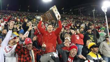 Nebraska football defensive end Garrett Nelson (44) shares the Heroes Trophy with fans after defeating the Iowa Hawkeyes at Kinnick Stadium. (Reese Strickland-USA TODAY Sports)