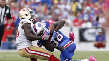 Oct 16, 2016; Orchard Park, NY, USA; San Francisco 49ers cornerback Tramaine Brock (26) tries to strip the ball from Buffalo Bills wide receiver Marquise Goodwin (88) after a catch during the second half at New Era Field. Buffalo beat San Francisco 45-16. Mandatory Credit: Kevin Hoffman-USA TODAY Sports