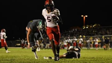 After evading last minute tackle attempts from two Hawks, Eau Gallie's Robert Stafford (5) strolls into the endzone for the team's third touchdown of the night.Viera V Eau Gallie Arron Lampkin 22