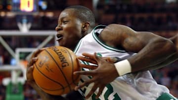 Apr 6, 2016; Boston, MA, USA; Boston Celtics guard Terry Rozier (12) tries to hang onto the ball as a New Orleans Pelicans hand reaches in during the second half of the Boston Celtics 104-97 win over the New Orleans Pelicans at TD Garden. Mandatory Credit: Winslow Townson-USA TODAY Sports