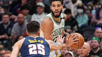 DENVER, CO - MARCH 20: Austin Rivers #25 of the Denver Nuggets defends Jayson Tatum #0 of the Boston Celtics at Ball Arena on March 20, 2022 in Denver, Colorado. NOTE TO USER: User expressly acknowledges and agrees that, by downloading and or using this photograph, User is consenting to the terms and conditions of the Getty Images License Agreement. (Photo by Ethan Mito/Clarkson Creative/Getty Images)