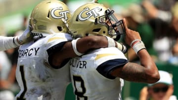 TAMPA, FL - SEPTEMBER 08: Tobias Oliver #8 of the Georgia Tech Yellow Jackets celebrates a touchdown during a game against the South Florida Bulls at Raymond James Stadium on September 8, 2018 in Tampa, Florida. (Photo by Mike Ehrmann/Getty Images)
