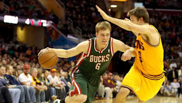 CLEVELAND, OH - DECEMBER 20: Nate Wolters #6 of the Milwaukee Bucks handles the ball against Matthew Dellavedova #9 of the Cleveland Cavaliers in the first half at Quicken Loans Arena on December 20, 2013 in Cleveland, Ohio. NOTE TO USER: User expressly acknowledges and agrees that, by downloading and/or using this photograph, user is consenting to the terms and conditions of the Getty Images License Agreement. (Photo by Mike Lawrie/Getty Images)