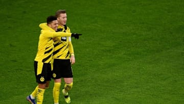 Jadon Sancho and Marco Reus helped Borussia Dortmund earn a vital win (Photo by SASCHA STEINBACH/POOL/AFP via Getty Images)