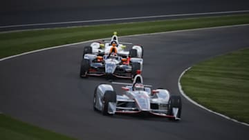 May 21, 2016; Indianapolis, IN, USA; Verizon Indy Car driver Will Power (12) leads a pack of car through the warm up lane in turn one during practice for the Indianapolis 500 at Indianapolis Motor Speedway. Mandatory Credit: Brian Spurlock-USA TODAY Sports