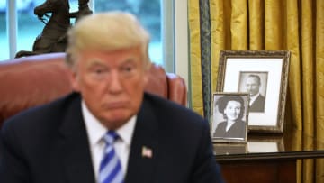 WASHINGTON, DC - AUGUST 28: Framed photographs of U.S. President Donald Trump's parents, Fred and Mary Trump, sit on a table in the Oval Office while the president meets with FIFA President Gianni Infantino at the White House August 28, 2018 in Washington, DC. The 2026 FIFA World Cup will be jointly hosted by the United States, Canada and Mexico and will be the first World Cup in history to be held in three countries at the same time. (Photo by Chip Somodevilla/Getty Images)