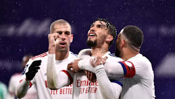 Lyon's Brazilian midfielder Lucas Paqueta (C) celebrates after scoring a goal during the French L1 football match between Olympique Lyonnais (OL) and SCO Angers, on April 11, 2021 at the Decines-Charpieu Olympique Lyonnais Groupama Stadium. (Photo by JEFF PACHOUD / AFP) (Photo by JEFF PACHOUD/AFP via Getty Images)