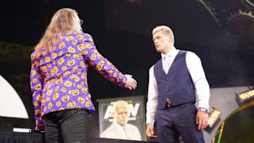 Cody and Chris Jericho sign the contract to make their AEW Championship match at Full Gear official. Photo: Lee South/AEW