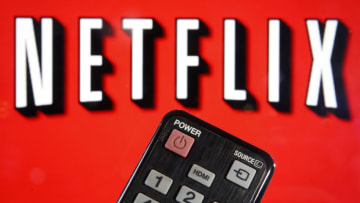 PARIS, FRANCE - MARCH 28: In this photo illustration, a remote control is seen in front of a television screen showing a Netflix logo on March 28, 2020 in Paris, France. Faced with the coronavirus crisis, Netflix will reduce visual quality for the next 30 days, in order to limit its use of bandwidth. (Photo Illustration by Chesnot/Getty Images)